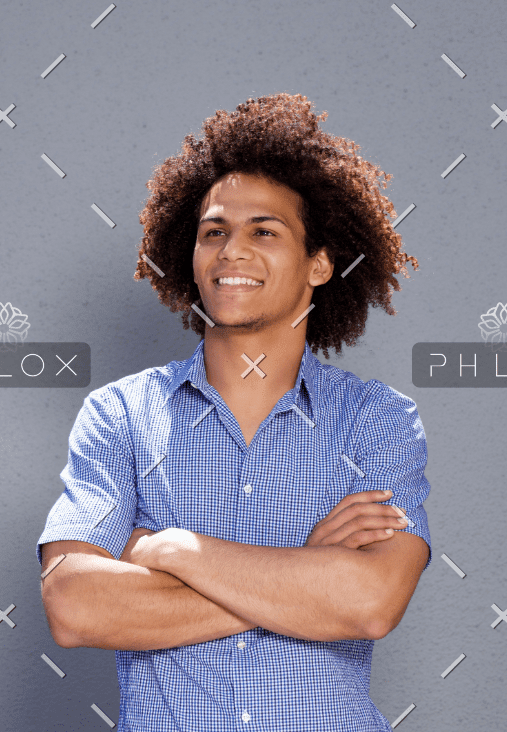 About smiling confident man standing with arms crossed DMBEGAW About